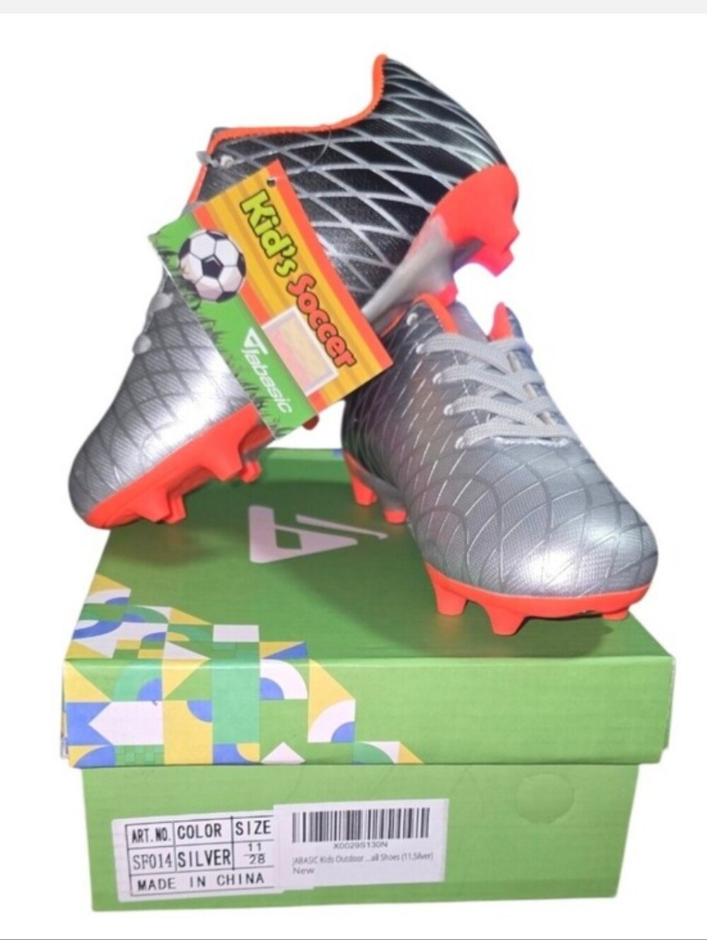 Kids Soccer Cleats in Silver with Orange Accents